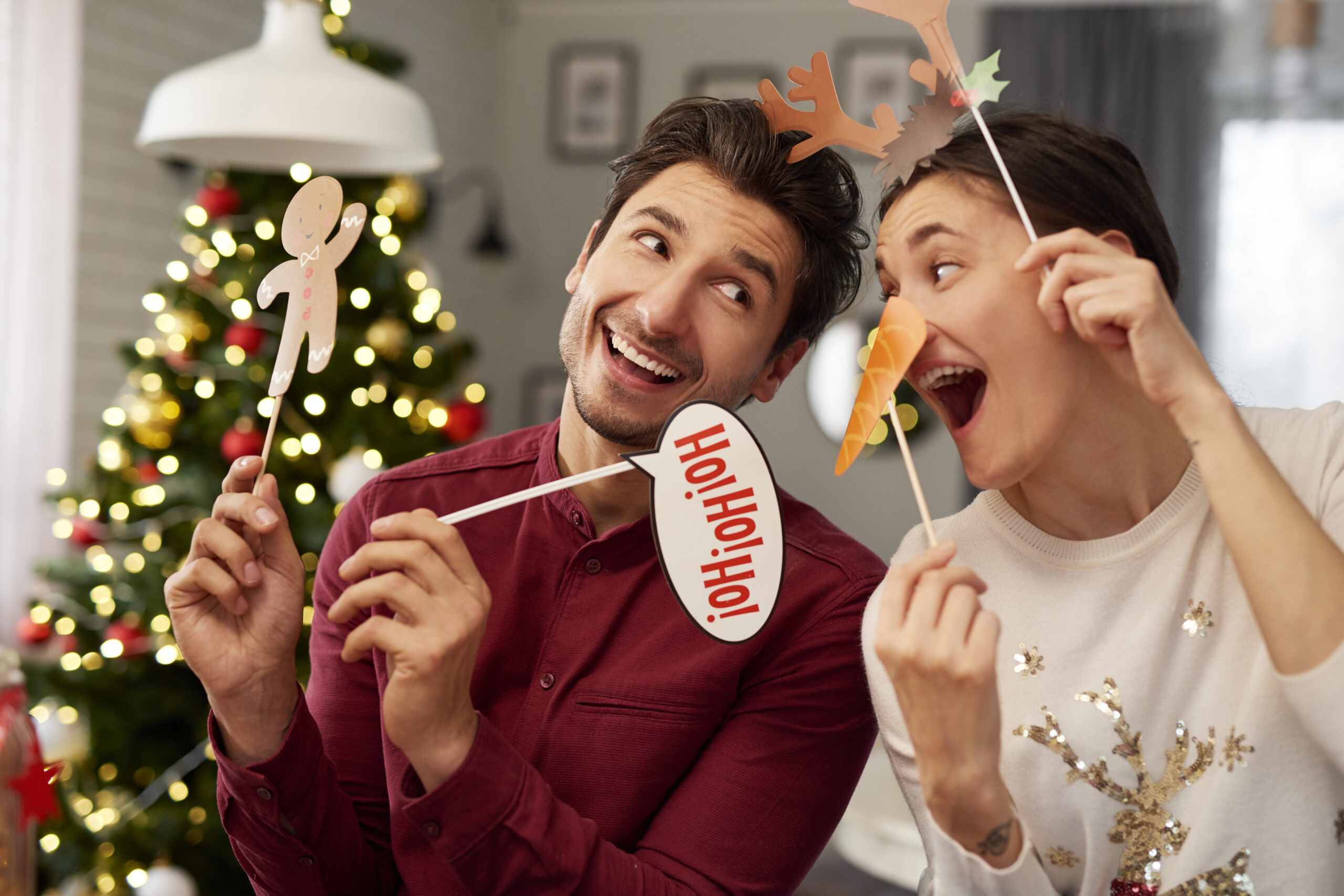 Playful couple christmas with masks